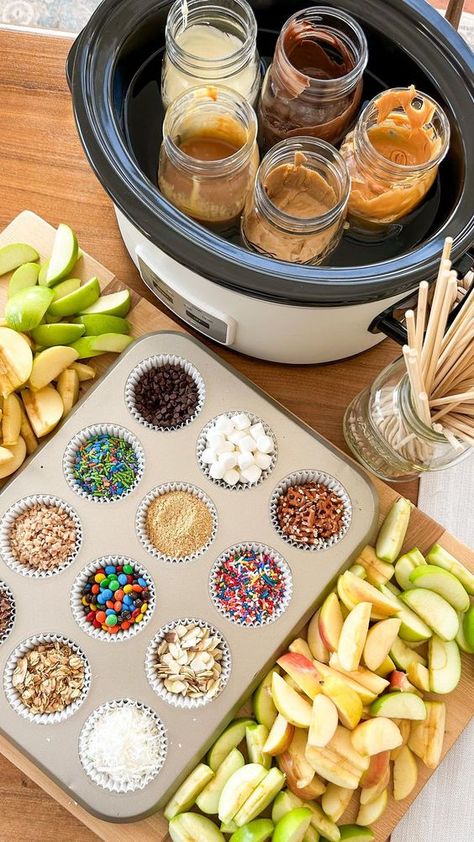 Caramel Apple Toppings: An Easy Fall Appetizer Board Idea - Our Journey To Home Fall Caramel Apple Board, Candy Apple Party Ideas, Caramel Apple Board Crockpot, Candy Apple Dipping Station, Caramel Apple Boards, Halloween Party Caramel Apple Bar, Fall Dip Board, Caramel Apple Dip Board, Carmel Apple Dippers