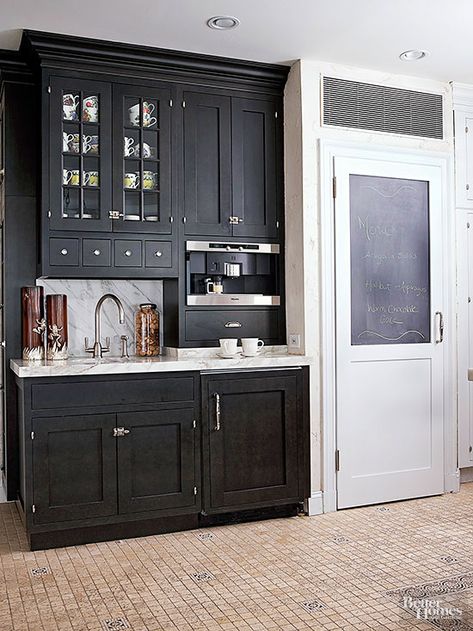 A section of walnut-stained cabinets serves as a beverage center complete with a bar sink, built-in espresso maker, coffee grinder, and a refrigerator drawer for cream and other extras. Built In Coffee Bar, Wet Bar Designs, Built In Coffee Maker, Home Coffee Stations, Coffee Bars In Kitchen, Coffee Nook, Beverage Center, Home Coffee Bar, Cocktails Bar