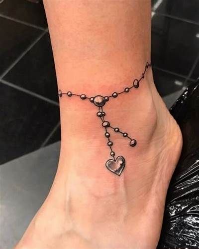 Charming Ankle Bracelet Tattoos That Will Amaze You - ALL FOR FASHION DESIGN Ankle Tattoos For Women Anklet, Ankle Bracelets Tattoos For Women, Ankle Bracelet Tattoos, Charm Anklet Tattoo, Bracelet Tattoo Ideas, Anklet Tattoos For Women, Charm Bracelet Tattoo, Bracelet Tattoos, Wrist Bracelet Tattoo