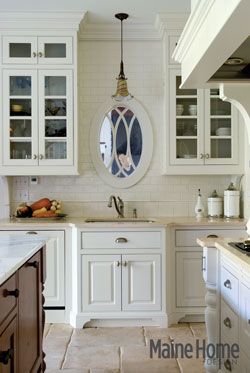 In Bar Harbor, rustic French farmhouse meets elegant country estate Mirror In Front Of Kitchen Sink, Blank Wall Over Kitchen Sink, Windowless Kitchen Sink, Mirror Over Kitchen Sink, Sink With No Window, Window Above Kitchen Sink, Windowless Kitchen, Mirror Centerpiece, Over Kitchen Sink