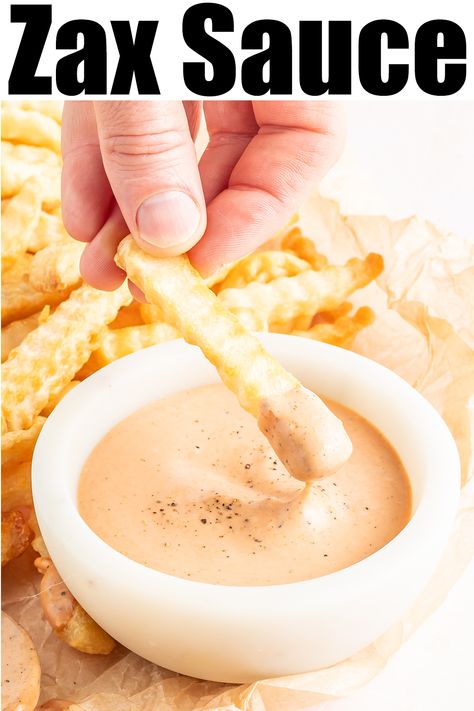 Bold text at the top reads "Zax Sauce". Underneath is a hand lifting the end of a crinkly french fry out of the creamy Zax sauce. Zax Sauce, French Fry Sauce, Sauce Ideas, Savory Dips, Comeback Sauce, Sriracha Aioli, Yum Sauce, Fried Chicken Tenders, Aioli Recipe