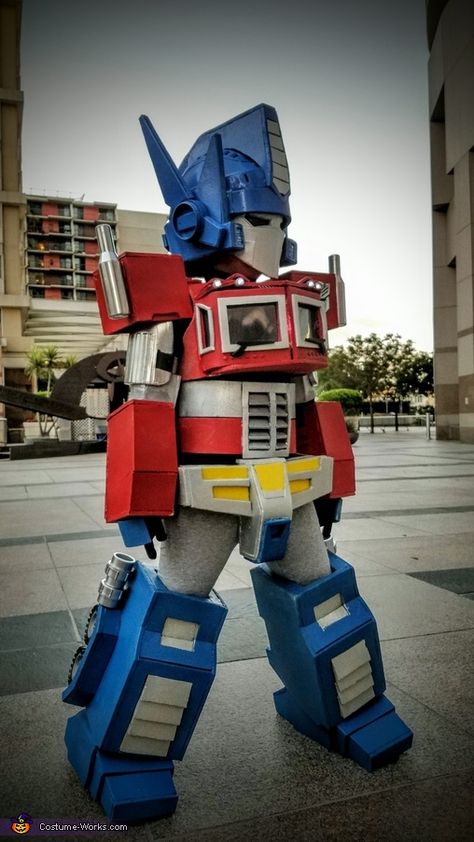 Transformers Trunk Or Treat, Family Transformers Costumes, Optimus Prime Party Ideas, Transformers Halloween Costume, Transformers Costumes Diy, Optimus Prime Costume Diy, Transforming Optimus Prime Costume, Cardboard Optimus Prime, Optimus Prime Halloween Costume