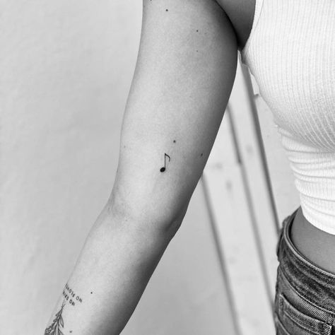 Minimalist music note tattoo on the inner arm Ear Tattoo Inner Music Notes, Quarter Note Tattoo, Music Note Tattoo Ankle, Music Key Tattoo, Dainty Music Note Tattoo, Tiny Music Note Tattoo, Fineline Music Tattoo, Fine Line Music Note Tattoo, Music Fine Line Tattoo