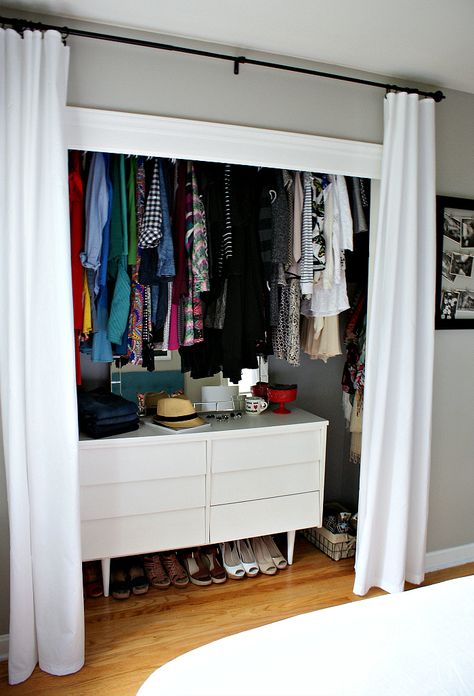 If you hang your closet's rod above eye level, you can slip in a sturdy (and stylish) dresser underneath. Curtains For Closet Doors, Ideas Armario, Organiser Son Dressing, Smart Closet, Dresser In Closet, Organized Closet, Closet Curtains, Open Closet, Small Closets