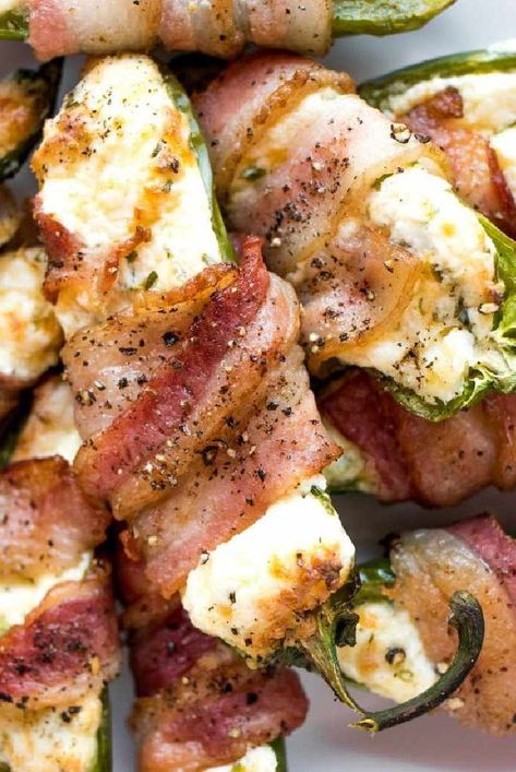 Cooked in an air fryer for easy cleanup and preparation, these bacon-wrapped, salami- and cheese-stuffed jalapeño poppers are perfect for a party. Air Fryer Jalapeno Poppers Bacon Wrapped, Bacon Wrapped Jalapeno Poppers Air Fryer, Bacon Wrapped Shrimp Air Fryer, Fried Jalapeno Poppers, Best Jalapeno Poppers, Bacon Wrapped Jalapeno Poppers, Jalapeno Popper Recipes, Bacon Wrapped Shrimp, Bacon Wrapped Jalapenos