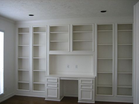 study with built in desk and shelves love the glass doors- no dusting!  I think I would put a fireplace where the desk is, though, and have the desk out in the room, maybe facing out the window. Bookshelves And Desk, Built In Desk And Shelves, Dark Wood Desk, Built In Bookshelves, Desk And Shelves, Office Built Ins, Shelves Kitchen, Built In Bookcase, Craft Room Office