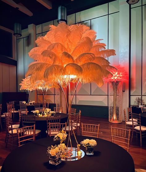 An opulent Birthday celebration at Bandrika Studios, where our ostrich feather centerpieces and glowing floor stands transformed the evening into a feast of elegance and style ✨😍🎇 • • • #ostrichfeathers #ostrichfeathercenterpieces #tablesetting #tablescape #tablestyling #weddingdecor #birthdaydecoration #featherfloorstand #rentfeathers #greatgatsby #greatgatsbyparty #birthdaideas Feathers Centerpieces, Ostrich Feather Decor, Ostrich Feather Centerpieces, Moms 60th, Feather Centerpieces, Roaring 20, Floral Installations, Great Gatsby Party, Dirty 30