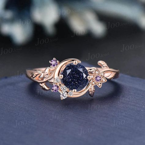 Nature Inspired Round Galaxy Blue Sandstone Amethyst Wedding Ring Unique Moon Leaf Vine Blue Goldstone Engagement Ring Art Deco Promise Ring Engagement Ring: round cut alexandrite The side stones are amethyst and moissanite Material Metal: 925 sterling silver, Solid 10k/14k/18k gold,platinum This jewelry is made to order, it can be made with any gemstone/metals. 2-3 weeks to finish. Default Shipping method is usps. 30 days non-hassle return policy.For returned items,there may be handcrafting and Luxury Celestial Moonstone Ring With Accent Stones, Luxury Gemstone Stackable Rings For Promise, Luxury Celestial Diamond Promise Ring, Nature Inspired Wedding Ring Alexandrite, Luxury Celestial Moonstone Ring For Anniversary, Engagement Ring Diamond And Moon Stone, Luxury Celestial Moonstone Ring For Wedding, Gem Stone Engagement Rings Topaz, Luxury Blue Gemstone Wedding And Engagement