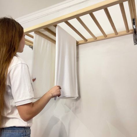 Our Wall Mounted Clothes Drying Rack offers a practical and efficient solution for drying laundry. Crafted from high-quality wood, this foldable design saves space while adding a touch of style to your home. Efficient and Space-Saving: Save money and floor space with our innovative drying rack. Hang wet clothes over the laths and raise them near the ceiling using the pulley system for quick and efficient drying. Customizable and Stylish: Tailor-made to fit your space, our drying rack comes in va Wall Mounted Clothes Dryer, Drying Laundry, Wall Mounted Clothes Drying Rack, Hanging Drying Rack, Wall Mounted Drying Rack, Hidden Laundry, Laundry Rack, Pulley System, Wall Mount Rack