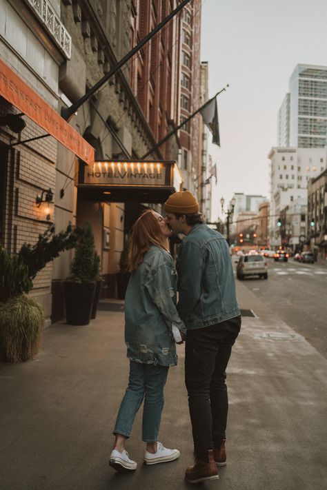 couple just got engaged in downtown Portland and were walking around enjoying the downtown views, shot in Portland Oregon by Miranda Harper photo Downtown Riverside Photoshoot, Portland Oregon Engagement Photos, Engagement Photos Town Square, Small Downtown Photoshoot, Couples Photos Downtown, Downtown Couple Photoshoot Summer, Engagement Photos Urban Setting, Engagement Photos Poses City, Town Couple Photoshoot