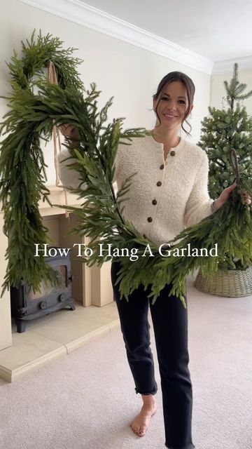 Garland On Fireplace Christmas, Bell Hanging Ideas, Making A Wreath Out Of Garland, Christmas Faux Fireplace Decor, Traditional Christmas Fireplace Garland, Wreath On Mantle Christmas, Bell Garland Mantle, Mantle Christmas Garland Ideas, Fireplace With Garland