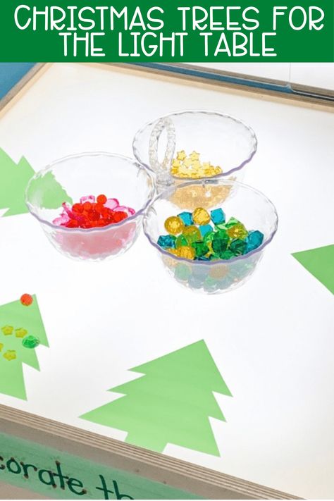 Christmas is just around the corner, so it's time to take out the Christmas trees for the light table! Preschool students love playing and learning at the light table, so why not throw in some holiday spirit? Click HERE for Info on How to Create Your Own! #lighttable #prekindergarten #prek #preschool #christmasactivities Christmas Light Table Ideas, December Light Table Ideas, Christmas Light Table, Christmas Light Table Preschool, Pre K Light Table Activities, Light Up Table Activities, Green Tissue Paper, Christmas Tree On Table, Christmas Units