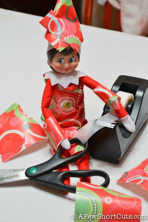 This Elf on the Shelf is all wrapped up in Christmas! http://afewshortcuts.com/2013/12/elf-on-the-shelf-all-wrapped-up/ Elf On The Shelves, Timmy Time, Shelf Elf, Elf Magic, Awesome Elf On The Shelf Ideas, Elf Activities, Xmas Elf, Elf Antics, Elf Fun