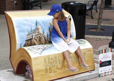 Finley Montague, 7, of Naperville, checks out the imagery of a newly installed book bench in downtown Naperville called "Harry Potter Mystery at the Carillon" by Ken Markiewicz of Crayons Gone Wild. The bench, at Jefferson Avenue and Main Street, is one of 15 such temporary seating spots installed early Friday by the Downtown Naperville Alliance and Naperville public works department. Benches For Outside, Background Hp, Book Bench, Cars Golf, Fantastic Beast, Paddington Bear, Harry Potter Fantastic Beasts, City Design, Golf Balls