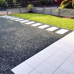 Black Gravel Driveway Ideas With Concrete Stepping Stones Gravel Driveway Ideas, Gravel Drive, Driveway Edging, Driveway Ideas, Gravel Landscaping, Concrete Stepping Stones, Stone Driveway, Driveway Design, Driveway Landscaping