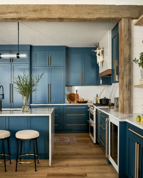 Navy Cabinets With Brass Hardware in Rustic Kitchen Indigo Cabinets Kitchen, Navy Wood Kitchen, Modern Teal Kitchen, Dark Navy Kitchen Cabinets, Kitchen Navy Island, Blue And Copper Kitchen, Cabinets With Brass Hardware, Walnut Kitchen Cabinets, Exposed Wood Beams