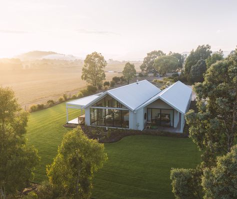 This beautiful home by #borlandarchitecture known as Polo House, was designed to enhance the liveability of the space, with a double-gable ended roof design, featuring #COLORBONDsteel #ShaleGrey in the #Fielders #Prominence profile. 📷 Porter Digital Double Peak House, Double Gable Front House, Double Gable Roof, Red Brick Bungalow, Three Examples Of Dutch Gable Roof Designs, Colourbond Roof, Polo House, One And Half Storey House Design Ireland, L Shaped Bungalow Plans Ireland