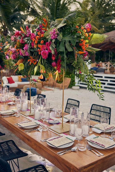 Pink and orange centerpieces create a tropical feel at this birthday party | Event inspiration, birthday party inspiration, birthday party inspo, event inspiration, luxury events, mexico events, tulum events, beach event, birthday tablescape, colorful decor, colorful party, beach event, beach birthday, 2023birthday, tropical decorations, tropical party, event decor, event ideas, floral centerpieces, birthday flowers #eventdecor #beachevent #birthdaydecor Pink And Orange Party Centerpiece, Latino Birthday Party Ideas, Tulum Inspired Party, Hibiscus Centerpieces, Tropical Glam Wedding Decor, Tulum Party Decor, Tropical 40th Birthday Party, Pink And Orange Centerpieces, Tropical Gala