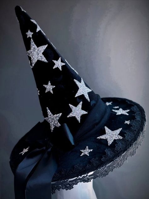 This bewitching black witch hat is adorned with glittering silver stars and delicate lace trim, perfect for those looking to shine with a touch of elegance at their next Halloween event. Age Group/Gender - Adult/Unisex Size/Type - One size fits all adults Hat Base Color - Black Hat Material - Fabric Lace Witch Hat, Moon Witch Hat, Witchy Style Mini Hats With Curved Brim For Party, Witchy Mini Hats With Curved Brim For Party, Witchy Party Hat With Short Brim, Witchy Short Brim Party Hat, Star Witch, Hat Halloween Costume, Witch Hat Halloween