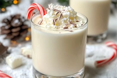 Learn how to make the Polar Bear Cocktail, a cool and refreshing mix of vodka, white chocolate liqueur, and mint. Perfect for winter parties and holiday celebrations! Polar Bear Drink, Bear Cocktail, Bear Drink, Xmas Drinks, White Chocolate Liqueur, Peppermint Syrup, White Chocolate Shavings, White Chocolate Mousse, Sweet Cocktails