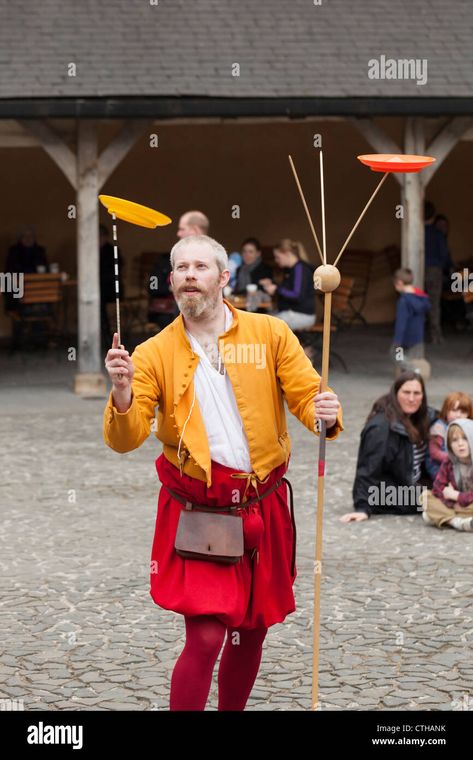 Download this stock image: Juggler in historic costume entertains crowd by spinning plates - CTHANK from Alamy's library of millions of high resolution stock photos, illustrations and vectors. Juggler Costume, Spinning Plates, Circus Ideas, Image Processing, Your Image, Circus, Spinning, Photo Image, High Resolution