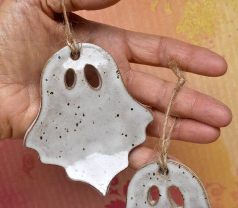 Ceramic handmade Halloween  hanging ornament.  Great for decorating door or  hanging on trees. Great gift for the Halloween. Measures approx. 3.25 inches tall  and 3 inches wide.  Comes with a twine rope.  Thanks for looking. Spooky Christmas Decorations, Ghost Ornaments, Halloween Ceramics, Pottery Halloween, Halloween Pottery, Halloween Door Decoration, Spooky Decorations, Chicken Figurines, Halloween Clay