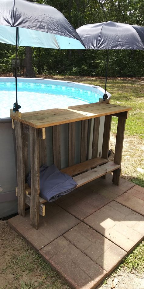 Diy Hot Tub Towel Rack Outdoor, Pool Box Ideas, Above Ground Pool Shelf Diy, Above Ground Pool Lounge Area, Pallet Pool Bar Diy Projects, Diy Poolside Table, Pool Shelf Ideas Above Ground, Pool Diy Ideas Decor, Diy Pool Landscaping Ideas