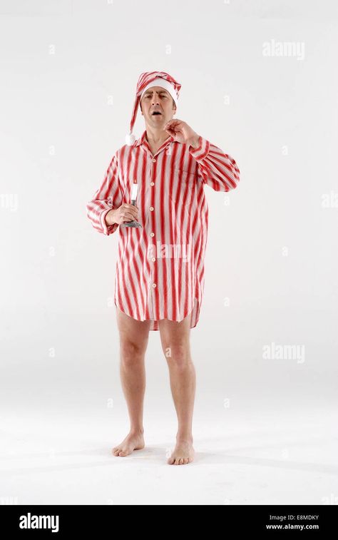 Download this stock image: Man dressed in fancy dress comedy costume, night time, victorian sleeping outfit, with nightcap, gown and candle. - E8MDKY from Alamy's library of millions of high resolution stock photos, illustrations and vectors. Doctor Sleep Costume, Fantasy Sleep Wear Male, Victorian Sleeping Gown, Night Outfits Sleep, Mens Nightgown Vintage, Mens Vintage Night Shirt, Sleeping Dress, Night Cap, Night Outfits