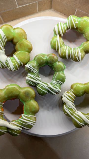 Jen Dao on Instagram: "Glaze of glory, pandan mochi donut edition. 🍩✨   Mochi donuts combine the chewy texture of mochi, made with glutinous rice flour (AKA mochiko), with the iconic shape and crispness of donuts. Originating from Japan and Hawaii, they have gained global popularity for their playful appearance (often in a ring of small spheres).  Full recipe:  @YouTube  & jenhdao.com/pandan-mochi-donuts  Ingredients 1 cup glutinous rice flour (mochiko flour) 3/4 cup tapioca starch 1/4 cup sugar 1 tsp baking powder 1/4 tsp salt 1/2 cup milk (any kind will do) 1 large  egg 2 tbsp unsalted butter, melted 1 tsp vanilla extract Oil for frying  Glaze Topping: 1 cup powdered sugar 2-3 tbsp milk (adjust for consistency) 1 tsp pandan extract White chocolate (melted)  #mochi #donut #donuts #mochid Dim Sum Party Theme, Savory Mochi, How To Make Mochi, Pandan Mochi, Mochi Donut Recipe, Mochi Donuts Recipe, What Is Mochi, Mochiko Flour, Mini Lemon Tarts