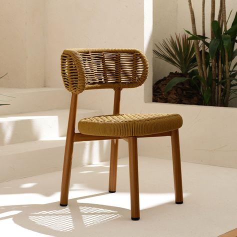 Introducing the Nomad Dining Chair, a masterpiece inspired by the organic elegance of nature. Crafted with meticulous attention to detail, each piece in this series showcases a three-dimensional weaving style that seamlessly integrates various techniques and textures, celebrating the beauty of adventure. Underlining the aesthetic fusion of the virtual and real, the Nomad Dining Chair features a minimalist aluminum frame complemented by a fully woven backrest and seat, offering a distinctive silhouette and unparalleled comfort. The backrest design, characterized by a double-layer woven structure, boasts recognizable parallel lines reminiscent of intricate patterns, evoking a sense of rational geometric beauty. Colors: Available in three sophisticated hues. Material: Aluminum/PVC rope Specif Chair Weaving, Woven Structure, Backrest Design, Rope Chair, Layered Weave, Swiss Chalet, Dining Room Blue, Room Blue, Outdoor Dining Chair