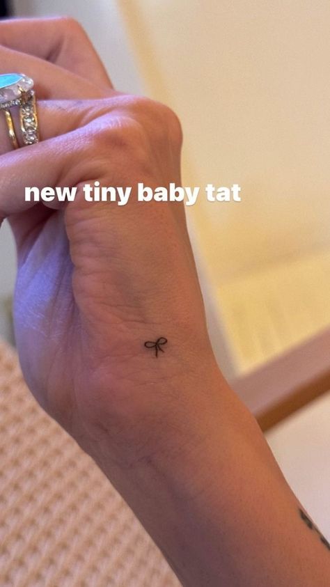 Hailey Bieber Bow Tattoo, Tiny Ribbon Tattoo, Mini Hand Tattoos For Women, Mini Bow Tattoo, Small Ribbon Tattoo, Dainty Forearm Tattoo Women, Dainty Forearm Tattoo, Hailey Bieber Hand Tattoo, Forearm Tattoo Women Words