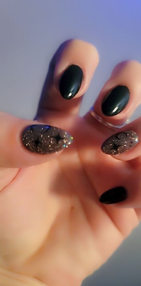 Celestial Black witchy nails with moon and star detail Black Party Nails Sparkle, Black And Gold Moon Nails, Black Nails For Prom Almond, Black Nails With Holographic Glitter, Black Almond Nails Designs Glitter, Black Glitter Almond Nails, Black Nails With Stars, Star Glitter Nails, Red Nail Designs For Prom