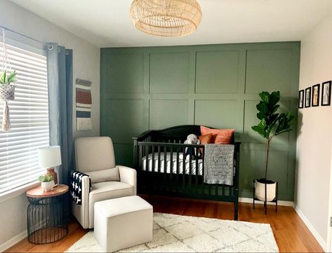 Green wall nursery Olive Green Accent Wall Nursery, Black Crib Green Walls, Black White And Green Nursery, Sage Green Wall Nursery, Sage And Black Nursery, Sage Green And Black Nursery, Sage Green Nursery Black Crib, Sage Green Wainscoting Nursery, Green Nursery Dark Wood