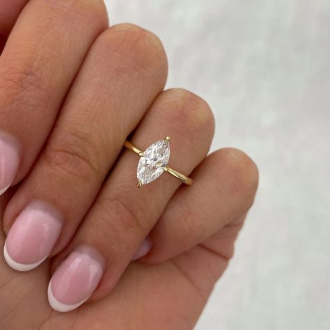 1.02 CT Marquise Moissanite Engagement Ring Unique 14k Solid Gold Solitaire Ring Marquise Cut Wedding Ring Dainty Bridal Ring Proposal Ring ❤ ITEM DETAILS:- ✦ Brand: TheAmericanJewelShop ✦ Handmade, high-quality item! ✦ Material: Solid 10K/14K/18K Gold, 950 Platinum and 925 Sterling Silver ✦ Diamonds Type: Colorless Moissanite Diamond ✦ Diamond Cut: Marquise Cut ✦ Center Diamond Weight: 1.02 CT ✦ Center Diamond Size: 5x10 MM ✦ Diamond Clarity: VVS/VS ✦ Width of Band: 1.6 Mm (Bottom) ----------------------------------------------------------------- 💎 Moissanite VS Diamond 💎 ------------------------------------------------------------------------------ 👉 Moissanite Maintain Their Clarity & Sparkle Throughout A Lifetime Just Like A Diamond. 👉Moissanites Are Actually More Brilliant (Sparkl Marquise Engagement Ring With Oval Band, Marquise Engagement Ring Dainty, Pointed Oval Engagement Ring, Marquise Engagement Ring 1 Carat, 1ct Marquise Engagement Ring, Marquis Gold Engagement Ring, Moissanite Engagement Ring Marquise, 1 Carat Marquise Engagement Ring, Wedding Band For Marquise Ring