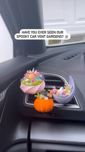 Spiritual Home Decor on Instagram: "NEW spooky car vent gardens will be available on my website TONIGHT at 7 PM est! 👻🎃 💫Each car vent garden is made with crystals intended to refresh your energy, boost joy, bring energetic protection and relieve stress! Which one is your favorite?✨ 🔮You’ll be able to find them under the Crystal Garden section of my site! Click on the subtab ‘car decor’! 🛎Tap the countdown on my story to turn on reminders 🫶🏻💕✨ *Reminder: be sure to check if your car vent Car Vines Decor, Goth Car Aesthetic, Spooky Car Interior, Spooky Car Decor, Halloween Car Decor, Witchy Car Decor, Tt Car, Goth Car, Halloween Car Decorations