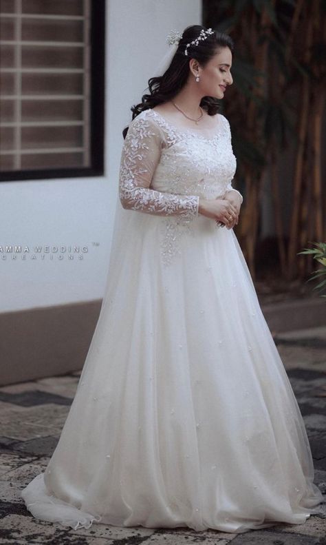 WhatsApp on 9496803123 to customise your handcrafted designer bridal wear with us online. Book your appointment today. We do ship internationally. (Pics for reference) Bridal White Frocks, Wedding Gowns Indian Christian, White Gown Wedding Indian, Kerala Christian Bride Gown, Christian Bride Gowns, Christian Bridal Gown, Frock Design For Wedding, Indian Christian Wedding, Wedding Gowns Indian