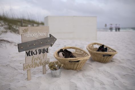 Beach sign with paint brushes to dust off sand and shoe baskets for guests. Beach Wedding Welcome Sign, Shoe Station Beach Wedding, Wedding Card Box Ideas Beach Theme, Shoe Valet Beach Wedding, Shoe Baskets, Beach Wedding Signs Cute Ideas, Standing Beach Wedding Ceremony, Beach Wedding Setup, Beach Wedding Signs