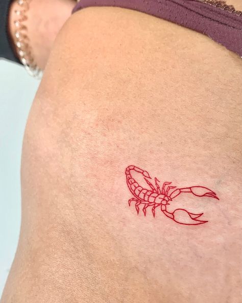 Scorpio tattoo, in red ink on a girls hip #girlytattoo #girltattoo #redtattoo #redink #redinktattoo #redscorpiotattoo #redscorpio #scorpiotattoo #scorpiontattoo #scorpion #instagram #tattoo #tattoos #tatuagem #portugaltatuagem #tatuadoresportugal #tattooportugal Scorpio Tattoo Hip, Scorpio Tattoo Minimalist Women, Scorpion Tattoo Feminine Outline, Scorpio Red Tattoo, Scorpion Tattoo Meaning, Scorpio Line Tattoo, Scorpion Minimalist Tattoo, Scorpion Tattoo Red, Small Scorpion Tattoo Woman