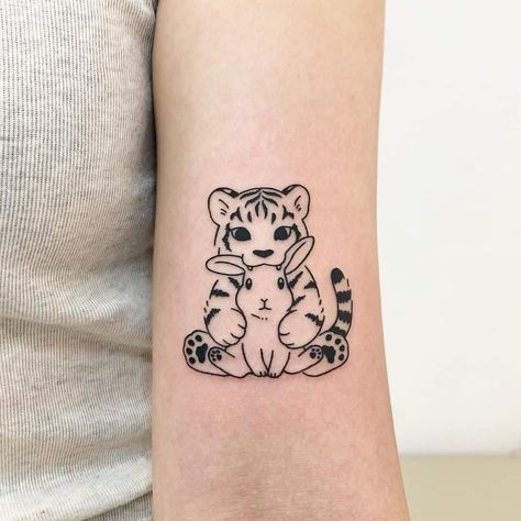 Tiger And Mouse Tattoo, Tiger Rabbit Tattoo, Mama Tiger Tattoo, Tiger And Bunny Tattoo, Tiger Cat Tattoo, Traditional Minimalist Tattoo, Year Of The Tiger Tattoo For Women, Cartoon Tiger Tattoo, Mini Tiger Tattoo