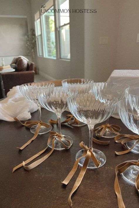 From an engagement party or bachelorette party to girls night with friends or birthday celebrations - tying bows around your champagne glasses is a classy, elegant, and timeless way to elevate any event or get together. These champagne coups are one of my favorite essentials to have as a hostess. Buy a set now using my affiliate link and get a ribbon color to match the vibe of your event! Engagement Party Dinner, Christmas Engagement Party, Tying Bows, Engagement Party Diy, Engagement Party Themes, Classy Bachelorette Party, Elegant Engagement Party, Champagne Birthday, Engagement Dinner