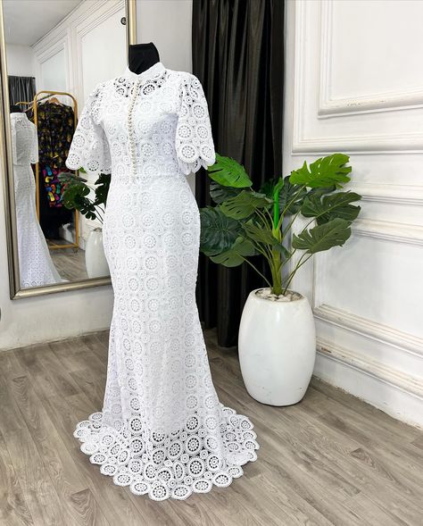 Dainty and delicate! This understated yet stunning bespoke dress for the Teramarg woman embodies soft femininity. Featuring a white cord lace fishtail design with a bishop collar, adorned with pearl buttons down the center bodice and bell sleeves. Perfect for making an elegant statement. Reach us on⬇️ ✅Click on the link on our bio to chat with us on WhatsApp ✅Send us a dm ✅Call us on 08103672667 ——————————————————— . . . . . . . . . . . . . . . . . . . . . . . . . #ankaradress #pre... White African Lace Styles, Cord Lace Styles For Women, Cord Lace Styles, Bishop Collar, Bespoke Dress, African Lace Styles, Native Dress, Lace Designs, Cord Lace