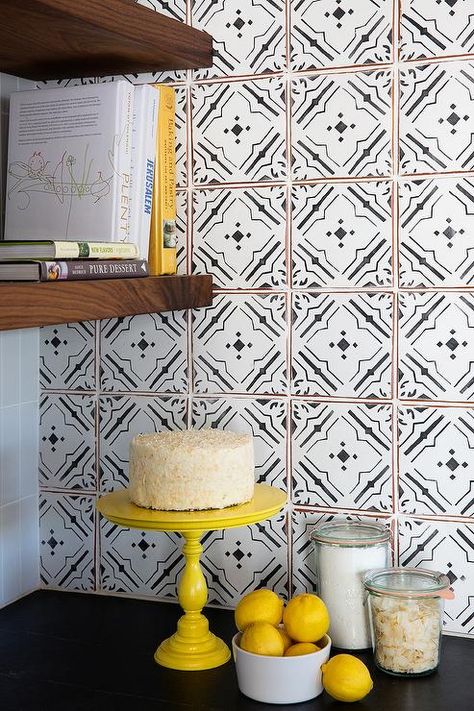 Black and white kitchen features a soapstone countertop and a white and black quatrefoil tile backsplash adjacent to a wall lined with stacked wooden floating shelves. Bold Kitchens, Black And White Backsplash, Trendy Kitchen Tile, Floating Shelves Bedroom, Floating Shelves Living Room, Bold Kitchen, White Kitchen Backsplash, White Tile Backsplash, Floating Shelves Kitchen