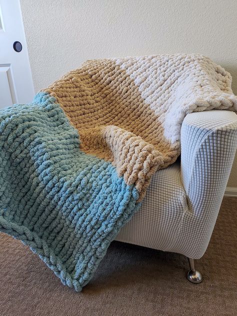 This chunky throw blanket is handmade with incredibly soft and fluffy chenille yarn, in the colors of ivory, beige, and spa blue. It is an elegant throw that aesthetically elevates any room. When curling up  with this blanket you will feel as if you are wrapped in a cloud. The knit is cozy and warm, yet still breathable and airy. From cool Spring evenings to brisk Winter nights, this is the perfect blanket for any weather and any occasion. Crochet Blanket Fluffy, Chunky Blanket Color Combos, Chunky Yarn Blanket Ideas, Knotted Blankets, Chunky Throw Blanket, Chunky Blanket Pattern, Chunky Knit Blanket Pattern, Knot Blanket, Chunky Yarn Blanket