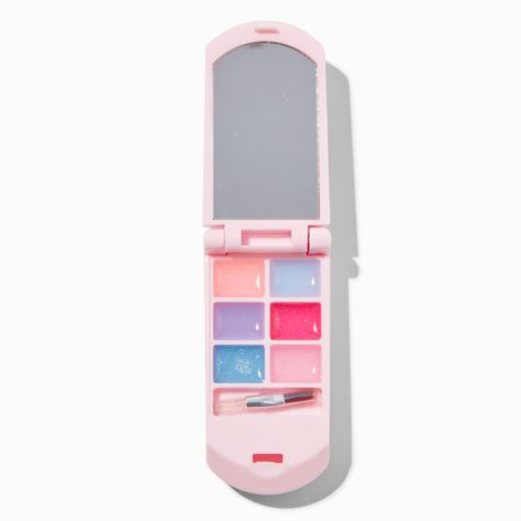 Instead of sending a text, use this flip phone lip gloss set to send a message that your makeup is always on point. Show off your cute cosmetic compact that holds 7 lip colors and comes complete with a mirror for application.Claire's Club is our unique collection specifically designed for our younger customers. Carefully constructed to be safe for toddlers & young children, these accessories are recommended for ages 3-6.Lip Gloss Set by Claire's Club. Included: 8 lip glosses, 1 applicator1.5W x 3H x 1D in.3.81W x 7.62H x 2.54D cm.Volume: 7 x 0.428 g/0.015 oz.Material: CreamSuitable for ages 3-6 - Claire's Club Pearl Heart Bling Flip Phone Lip Gloss Set Y2k Makeup Phone, Flip Phone Makeup, Makeup Flip Phone, Lip Glosses Aesthetic, Flip Phone Mirror, Cute Lipgloss, Claire's Makeup, Lock Diary, Phone Craft