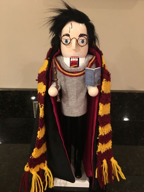 Our daughter loves Harry Potter & nutcrackers. I wanted to buy one but couldn’t find any. I saw a nutcracker in Michaels with white hair & glasses & modified him with a black hair, velvet cape, crocheted a scarf & made his sweater out of a sock. Custom Nutcracker Ideas, Harry Potter Nutcracker, Nutcracker Redo, Pirate Nutcracker, Halloween Nutcrackers, Unique Nutcrackers, Nutcracker Inspiration, Nutcracker Diy, Funny Nutcracker