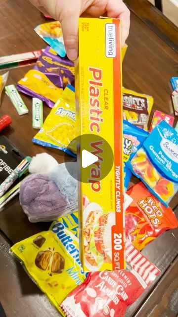 Auntie Coo Coo on YouTube on Instagram: "Saran Ball Game in less than 60 seconds⏱️ This is perfect for anyone Clearance Shopping after Christmas, and perfect family friendly fun for New Year’s Eve Parties! Grab some Saran Wrap, Pot Holders, Dice and Goodies and play the game that everyone wins!   #saran #saranball  #saranwrap  #saranwrapgame  #plasticwrap  #minutetowinit  #partygames  #familyfriendly  #newyearseve  #game  #greed  #dollartree  #dollargeneral  #lastminutegifts  #lastminute  #clearanceshopping  #holidayparty" Christmas Games For Family Saran Wrap, Sarah Wrap Ball Game, Christmas Game Saran Wrap Ball, Cling Wrap Ball Game, Saran Wrap Ball Game Prizes Ideas Adults, Saran Ball Game, Saran Wrap Ball Game Prizes Ideas, Saran Wrap Christmas Game, Plastic Wrap Ball Game