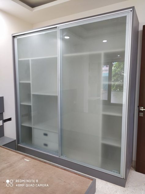 Glass sliding almirah Glass Almirah Designs, Wardrobe Inside Design Storage, Glass Almirah, Wardrobe Inside Design, Glass Sliding Wardrobe, Glass Kitchen Cabinet Doors, Closet Small Bedroom, Almirah Designs, Bedroom Cabinet