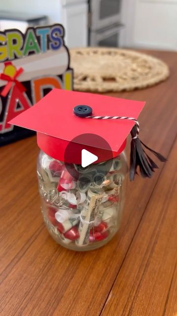 Hip2Save | Legit deals only. Follow for the best savings around! on Instagram: "Attending a grad party? These DIY graduation mason jars make the perfect gift! 👩🏼‍🎓🧑🏼‍🎓  Comment LINK and we’ll DM you a link with all the details & directions!  *These DIY jars can also be used as a party centerpiece! Swap out the dollar diplomas for candy, confetti, or any other grad fillings!  #diy #graduation #giftidea #grad #graduationgift #hip2save @ballcanning" Graduation Candy Gift Ideas, Graduation Mason Jars, Graduation Hat Toppers, Mason Jar Party Favor, Diy Jars, Lolly Jars, Candy Centerpieces, Graduation Candy, Graduation Money