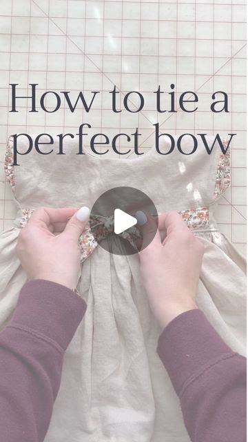 Amelia Mccall- teaching moms to sew children's clothes on Instagram: "Once you saw all those dresses, you’re going to need to know how to tie a perfect bow! 🎀 share this to help out your fellow girl mamas! #girlmomhacks #sewingtipsandtricks" How To Tie A Perfect Bow On A Dress, How To Tie A Fabric Bow, How To Tie Waist Bow, How To Tie A Pretty Bow On A Dress, How To Tie A Flat Bow, How To Tie A Bow Around Something, How To Tie A Bow With Ribbon On A Dress, Tie A Bow On A Dress, How To Tie A Perfect Bow