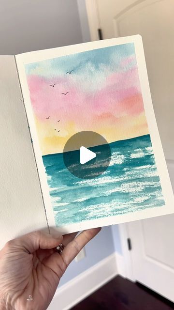 Andrea Nelson on Instagram: "This simple summer sketchbook page is the perfect thing to try if you’re new to watercolor or if you just want something that’s really easy but will make you super proud! Supplies are my brand and are on my page   Supplies: Watercolor sketchbook 24 color essential palette Size 8 round brush Artist tape .2 pen Dr martins bleed proof white  #easyart #easywatercolor #summerart #watercolorbeach" Summer Sketchbook, Andrea Nelson Art, Andrea Nelson, Watercolour Challenge, Busy Mind, Relaxing Art, Watercolor Sunset, Handmade Paint, Loose Watercolor